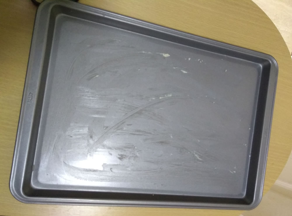 Bandeja para horno con mantequilla